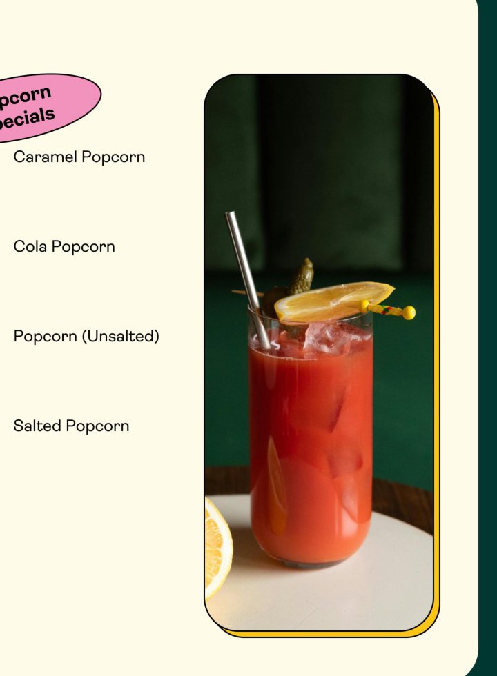 Vibrant red cocktail garnished with lemon